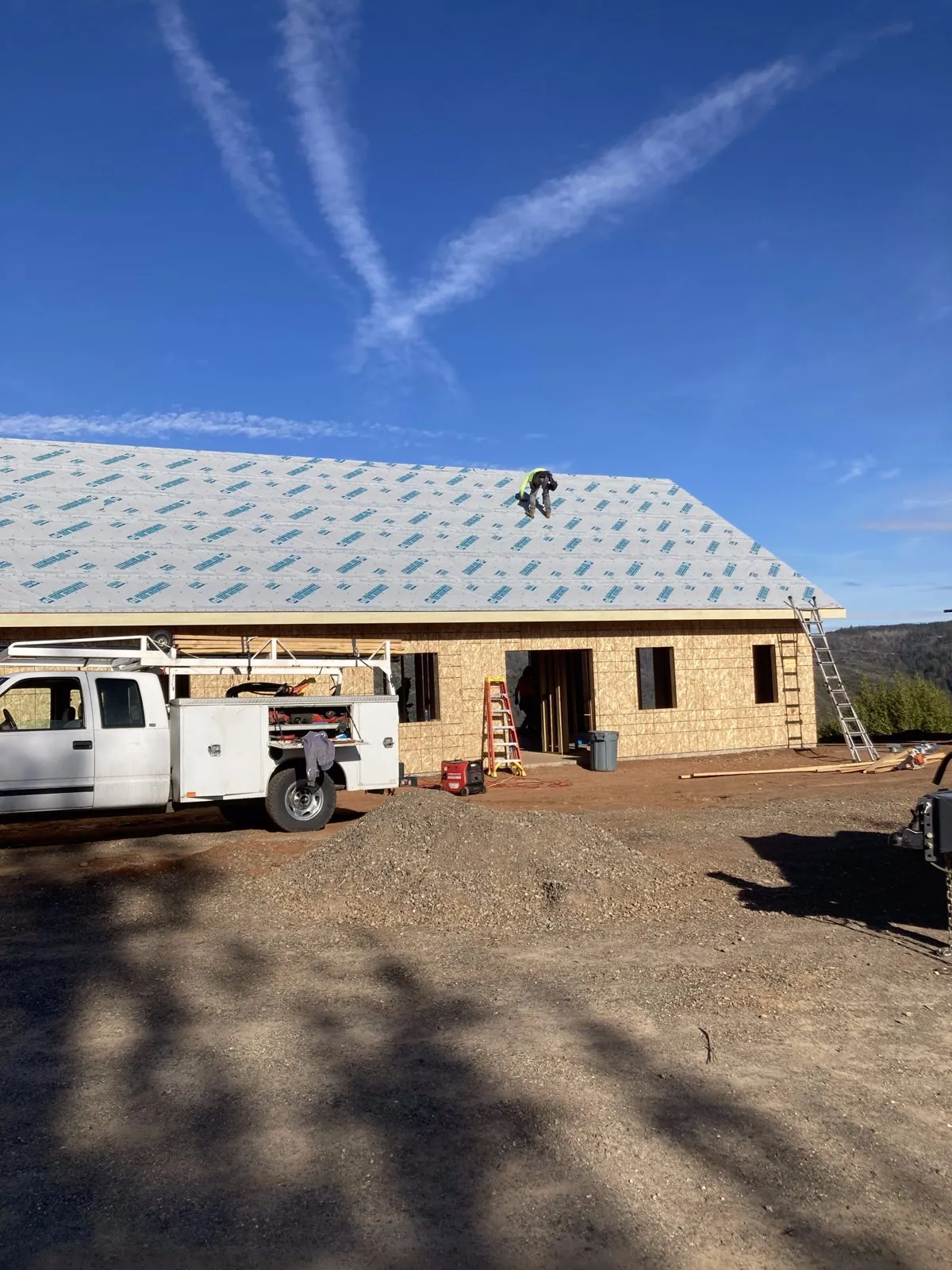 New roof underlayment installation on new construction home
