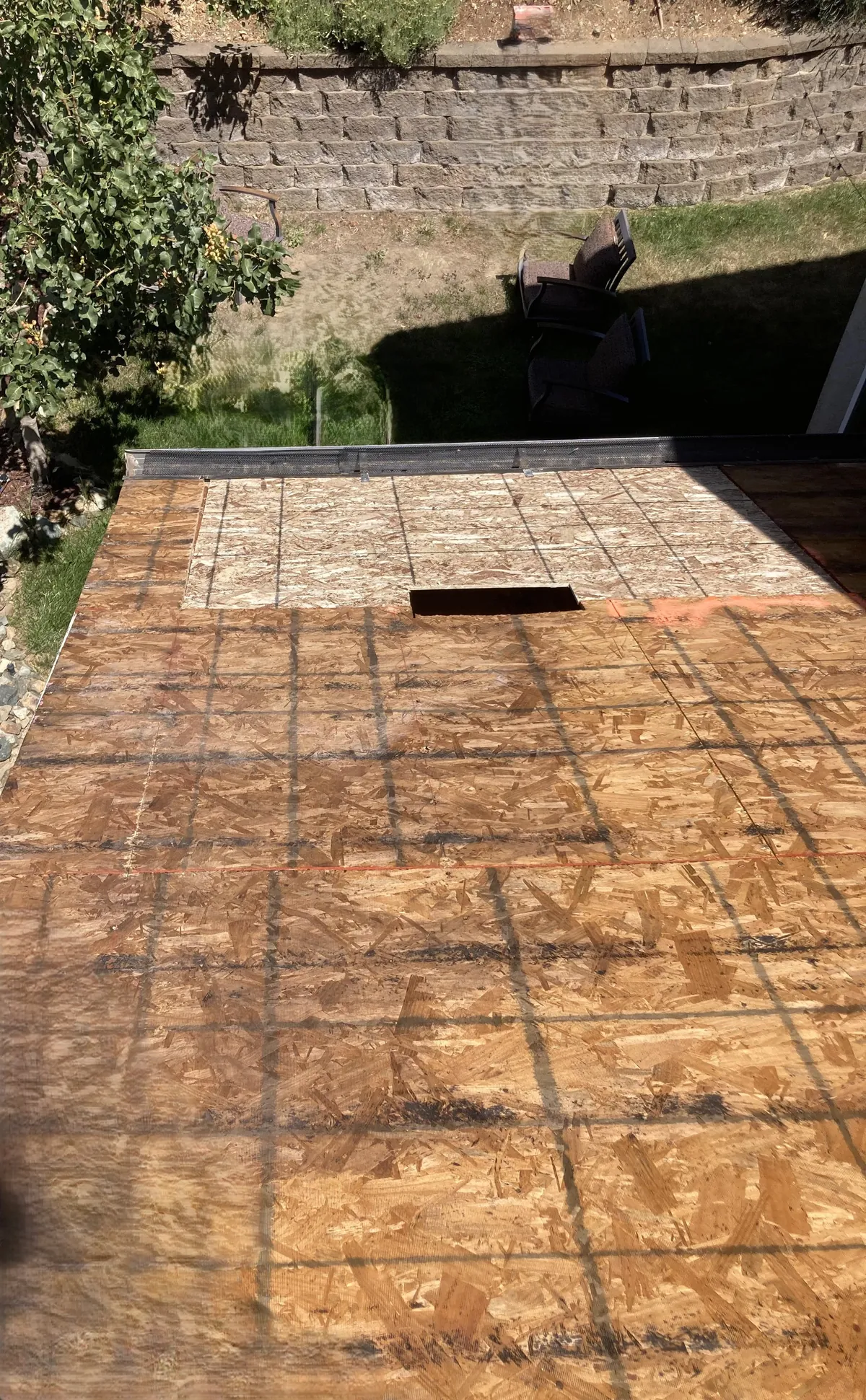 New OSB roof re-deck with chalk lines, ready for underlayment